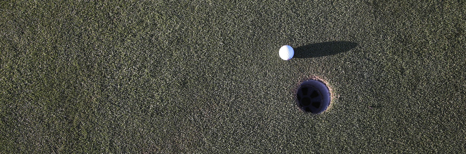 Golf ball near hole